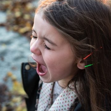 girl-wearing-black-jacket-and-gray-shirt-with-open-mouth-116151